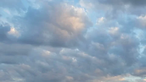 Formation and rapid movement of white clouds in the blue sky in spring Stock Footage 90398548