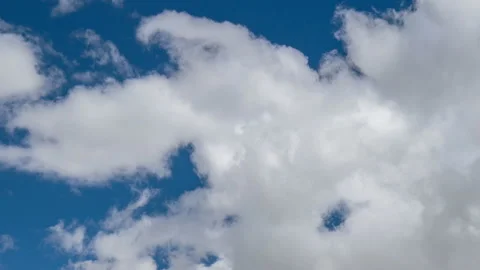 Formation and rapid movement of white clouds in the blue sky in spring Stock Footage 90398752