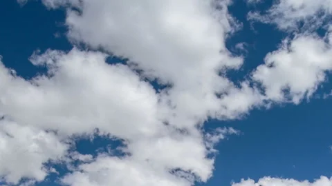 Formation and rapid movement of white clouds in the blue sky in spring Stock Footage 90398775