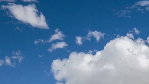 Formation and rapid movement of white clouds in the blue sky in spring Stock Footage 90398808