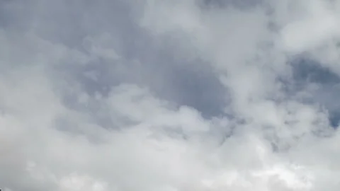 Formation and rapid movement of white clouds in the blue sky in spring Stock Footage 90398837