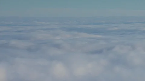Formation and rapid movement of white clouds of different shapes in the blue sky Stock Footage 103377063