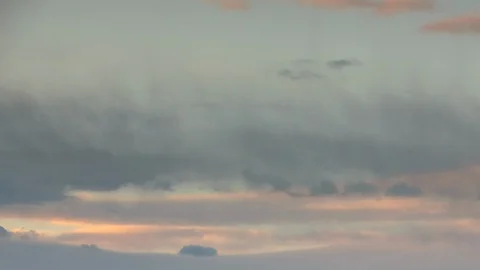 Formation and rapid movement of white clouds of different shapes in the blue sky Stock Footage 103377353