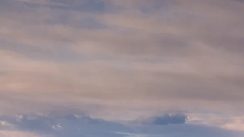 Formation and rapid movement of white clouds of different shapes in the blue sky Stock Footage 103377533