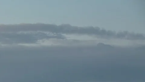Formation and rapid movement of white clouds of different shapes in the blue sky Stock Footage 103377784