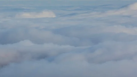 Formation and rapid movement of white clouds of different shapes in the blue sky Stock Footage 103377799