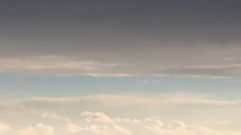Formation and rapid movement of white clouds of different shapes in the blue sky Stock Footage 103377844