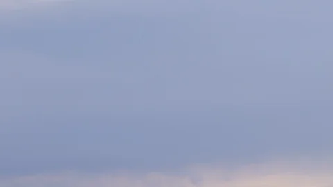 Formation and rapid movement of white clouds of different shapes in the blue sky Stock Footage 103377948