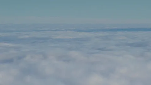 Formation and rapid movement of white clouds of different shapes in the blue sky Stock Footage 103378072
