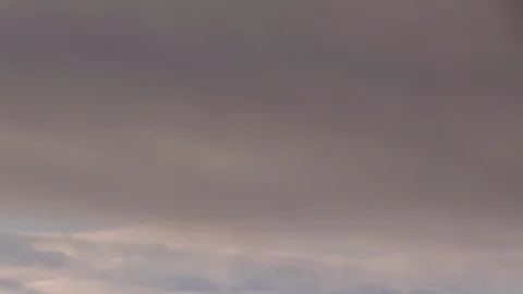 Formation and rapid movement of white clouds of different shapes in the blue sky Stock Footage 103378164