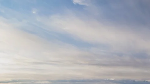 Formation and rapid movement of white clouds of different shapes in the blue sky Stock Footage 103378274