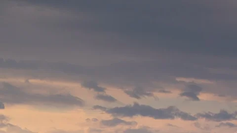 Formation and rapid movement of white clouds of different shapes in the blue sky Stock Footage 103378359