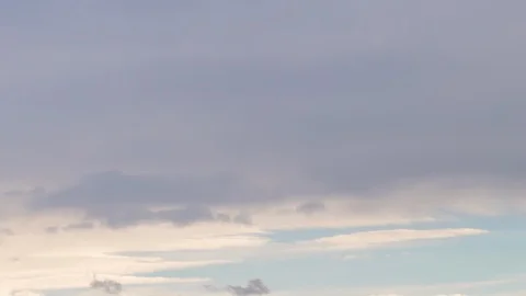 Formation and rapid movement of white clouds of different shapes in the blue sky Stock Footage 103378380