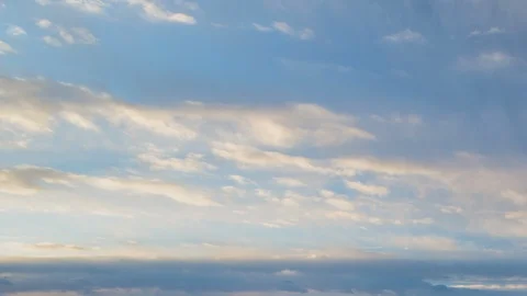 Formation and rapid movement of white clouds of different shapes in the blue sky Stock Footage 103378394