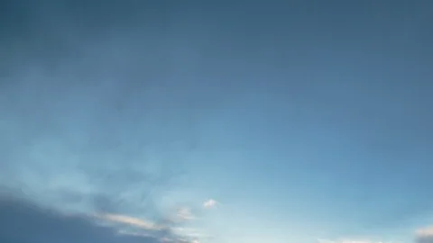 Formation and rapid movement of white clouds of different shapes in the blue sky Stock Footage 103378477