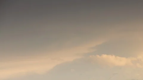 Formation and rapid movement of white clouds of different shapes in the blue sky Stock Footage 103378496