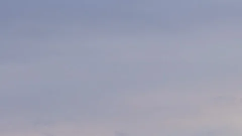 Formation and rapid movement of white clouds of different shapes in the blue sky Stock Footage 103378593