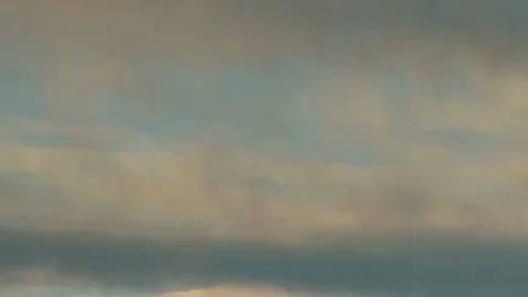 Formation and rapid movement of white clouds of different shapes in the blue sky Stock Footage 103378644