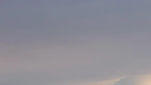 Formation and rapid movement of white clouds of different shapes in the blue sky Stock Footage 103378662