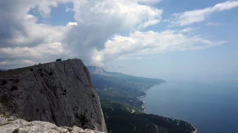 The formation of clouds between the mountains and the sea. Black Sea. Summer 動画素材 62294956