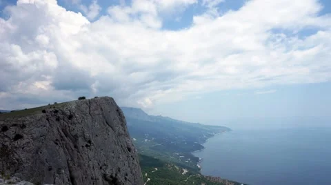 The formation of clouds between the mountains and the sea. Black Sea. Summer 動画素材 62294976