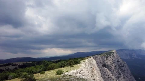 The formation of clouds between the mountains and the sea. Black Sea. Summer 動画素材 62295030
