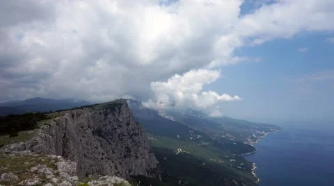 The formation of clouds between the mountains and the sea. Black Sea. Summer 動画素材 62295043
