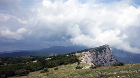 The formation of clouds between the mountains and the sea. Black Sea. Summer 動画素材 62295048