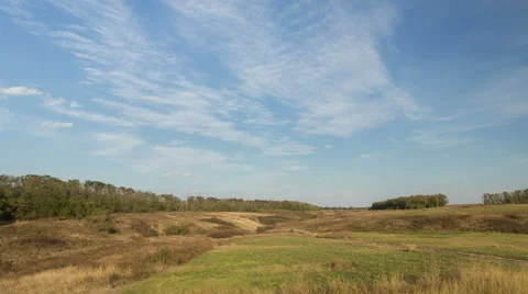 The formation of clouds over autumn endless green fields of grass Stock Footage 67736808