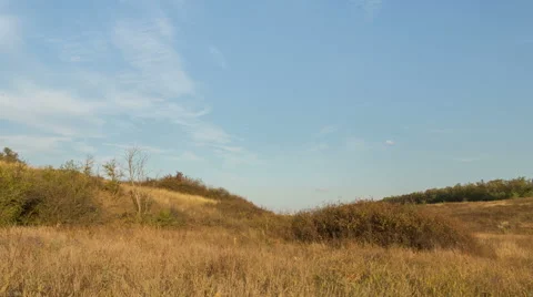The formation of clouds over autumn endless green fields of grass Stock Footage 67737852