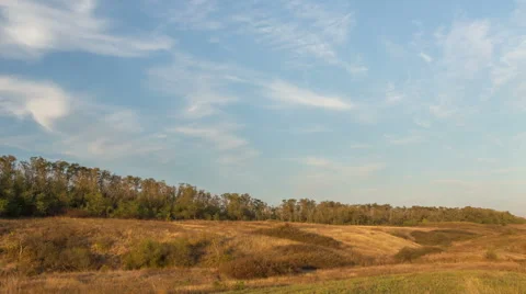 The formation of clouds over autumn endless green fields of grass Stock Footage 67738946