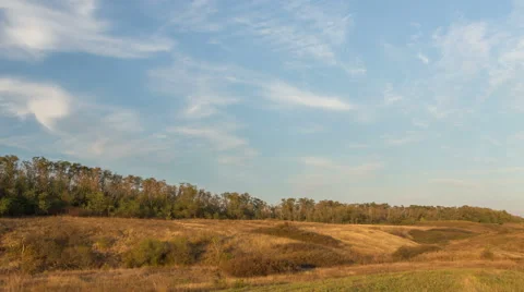 The formation of clouds over autumn endless green fields of grass Stock Footage 67740520