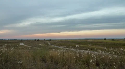 The formation of clouds over autumn endless green fields of grass Stock Footage 67745498