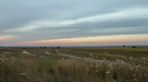 The formation of clouds over autumn endless green fields of grass Stock Footage 67747690