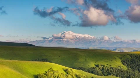 The formation of clouds over the mountains. Mountain Elbrus. Stock Footage 52690887