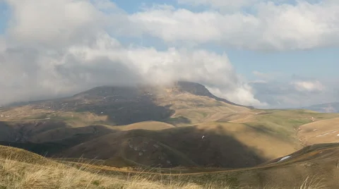 The formation  of clouds up to the slopes of the mountains of Caucasus Stock-Footage 66729944