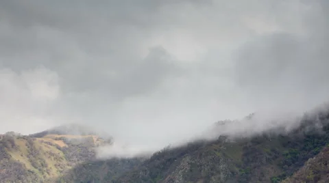 The formation of clouds up to the slopes of the mountains of Caucasus Stock Footage 66764064