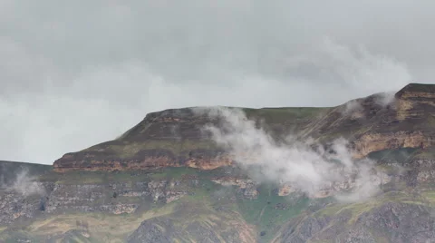The formation  of clouds up to the slopes of the mountains of Caucasus 動画素材 66764371