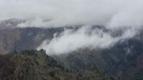 The formation of clouds up to the slopes of the mountains of Caucasus 스톡 동영상 66765514
