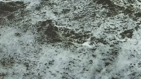 Formation of coastal foam waves Stock Footage 132180104