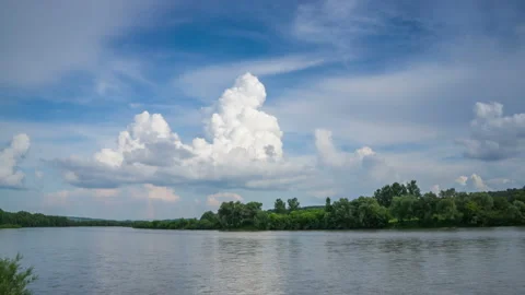 Formation of cumulus clouds in the sky over the river. The appearance of a cloud Stock Footage 170701037