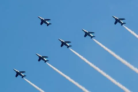 Formation flight of Blue Impulse over the Tokyo olympics stadium Stock Photos