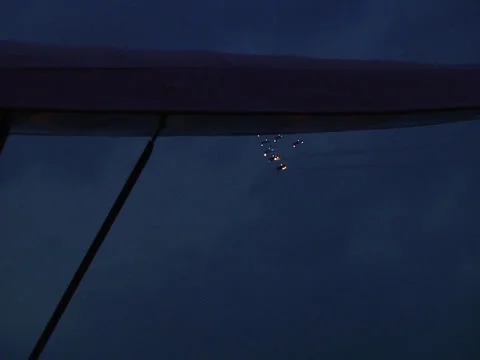 Formation flying 11 planes at night Stock Footage 22984097