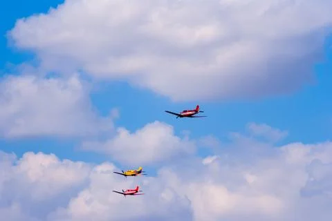 Formation flying light training and commercial aircraft Stock Photos