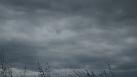 Formation of gray rain clouds with the wind after white clouds darkening before  Stock Footage 221973673