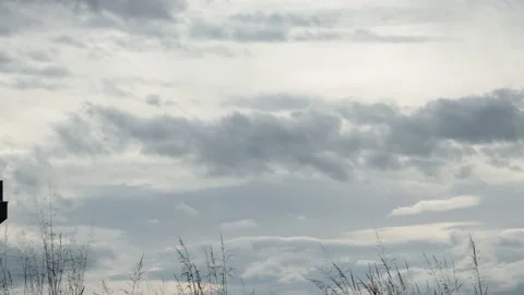 Formation of gray rain clouds with the wind after white clouds darkening before  Stock Footage 221973779