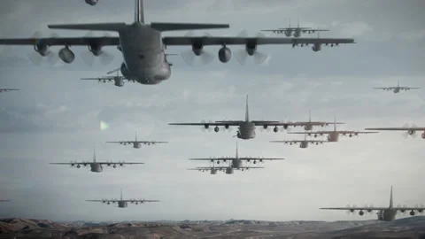 Formation of multiple military AC-130 gunship aeroplanes heading for a para drop 스톡 동영상 150274211