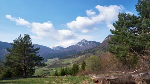 The formation of storm clouds in the blue sky, the high mountains in the spring 動画素材 190860947