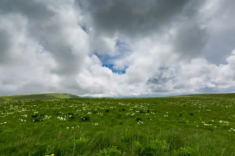 The formation of storm clouds over the mountains. Stock Footage 52690426