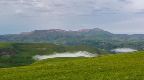 The formation of storm clouds over the mountains. Fog. Stock Footage 52691802